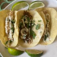 3 tacos choice of chicken, beef, or pork · comes with chopped white onions, cilantro, grated Cotija cheese, 
