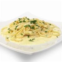 Fettuccine Alfredo · A generous portion of fettuccine smothered with our delicious Alfredo sauce. Served with a g...
