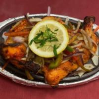 Tandoori Chicken · Half Chicken (Leg ＆ Breast) marinated in spices and baked in Tandoor (Clay oven).

Served wi...