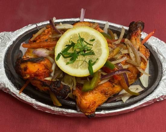 Tandoori Chicken · Half Chicken (Leg ＆ Breast) marinated in spices and baked in Tandoor (Clay oven).

Served with Basmati Rice.