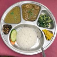 Daal Bhaat Tarkari (Lentil Rice) · Rice, mas ko daal (black lentils), rayo saag(green mustard), mula ko achar(radish pickle), g...