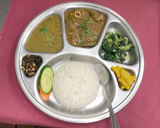 Daal Bhaat Tarkari (Lentil Rice) · Rice, mas ko daal (black lentils), rayo saag(green mustard), mula ko achar(radish pickle), gundruk ko achar(pickle of fermented leafy vegetable)( choice of curry vegetable of the day or khasi ko tarkari (goat curry) or kukhura ko tarkari(chicken curry) 