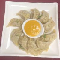 Chicken or Pork Mo:Mo (Dumpling)  · Minced chicken mixed with Nepali spices and steamed inside a flour dough shell, served with ...