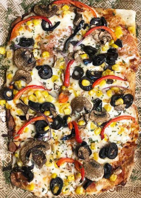 Veggie Pizza · Peppers, Onions, Corn, Black Olives, Mushrooms, Tomato Sauce & Mozzarella Cheese.