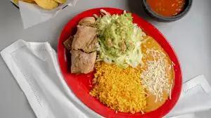 Carnitas Fajitas · A delicious marinated pork cooked with onions, tomatoes, and peppers. Served with rice and beans and salad.