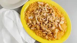 Arroz Con Pollo Y Chorizo · Cooked Mexican rice served with grilled chicken and delicious chorizo covered with white que...