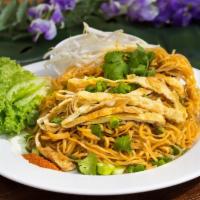 Khaw Mee · Lao stir-fried noodles. Rice noodles with sweet soy sauce. Topped with eggs and garnished wi...