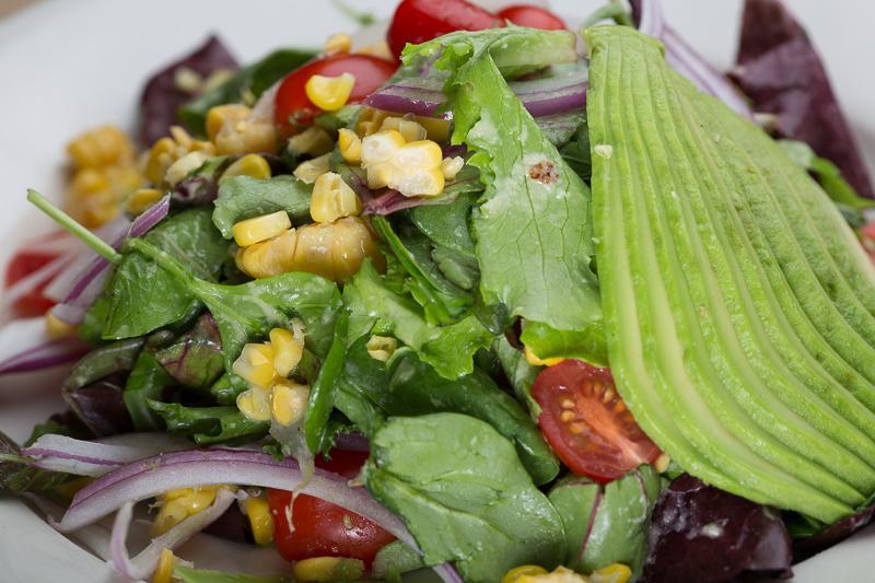 Verde Verde Ensalada · Mixed baby greens corn, red onion, tomato and avocado with ginger dressing.