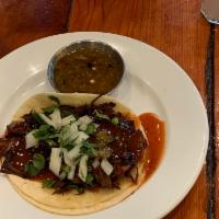 BBQ Beef Taco · Shredded beef.  All soft tacos served with onion, cilantro  Crispy tacos served with pico, l...