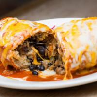Chimchanga Burrito · Fried burrito, choice of meat with rice and beans. Topped with enchilada sauce and cheese.