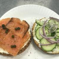 Salmon lox · Salmon lox in cream cheese bagel, cucumber, tomato, capers, red onions