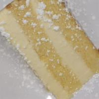 Plain New York Style Cheesecake · Made with real cream cheese and a graham cracker crust.