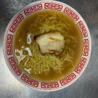 Kids Shoyu Ramen · Light chicken broth mix seasoned with soy sauce, pork chashu and wavy noodle.