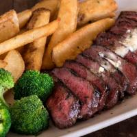 Steak Frites · Marinated flat-iron steak grilled & thinly sliced, topped with garlic butter & served with s...