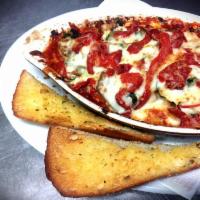 Chicken-Eggplant Parmesan · Chicken breasts placed on bed of marinara, topped with eggplant roasted red peppers, goat ch...