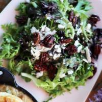 Mixed Greens · Maple candied pecans, ricotta salata, and honey citrus vinaigrette served on the side.