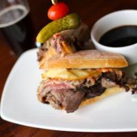 Prime Rib Dip PC-Style Sandwich · Fire-roasted bell peppers, caramelized onions, and smoked gouda cheese, ciabatta.
