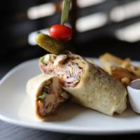 Chicken and Bacon Wrap · Rotisserie chicken, applewood bacon, roma tomato, romaine, chipotle ranch, garlic herb torti...