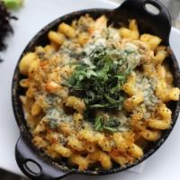 Buffalo Mac · Spicy Buffalo cream sauce, rotisserie chicken, toasted bread crumbs, blue cheese crumbles, a...