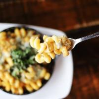 Mac and Cheese Family · Cheesy mac with rotisserie chicken, toasted asiago and parmesan bread crumbs, caesar salad w...