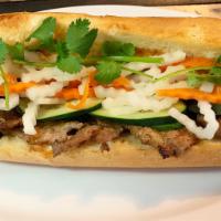 Grilled Chicken Banh Mi · Grilled Chicken, House Pickled Daikon and Carrots, Cucumber, Jalapeno, Cilantro and in a toa...