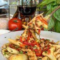 Rustica Pasta · Chicken, artichoke hearts, roasted red peppers and sun-dried tomatoes in a white wine sauce.