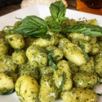 Gnocchi al Pesto Pasta · Fresh potato pasta combined with walnuts, extra virgin olive oil, fresh basil in a pesto cre...