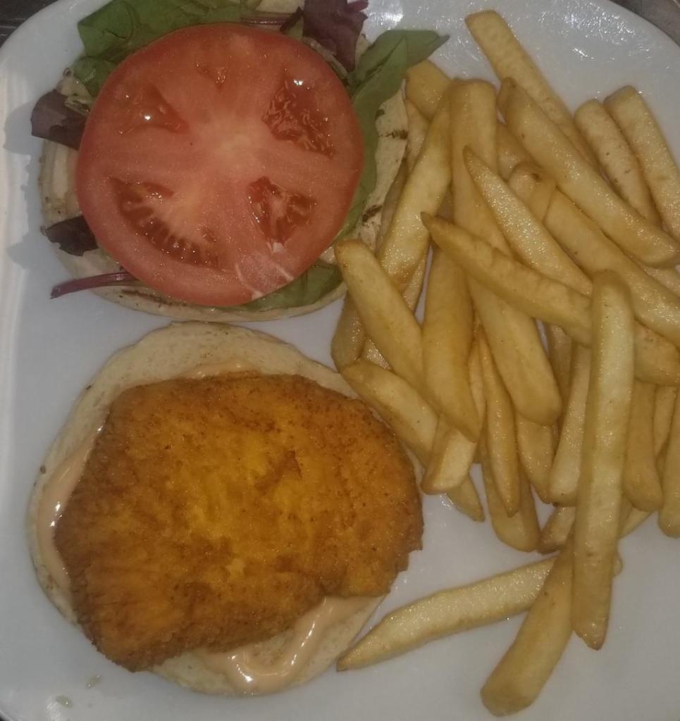 Crispy Chicken Sandwich · Well seasoned chicken breast pan fried to golden perfection.
Served with fresh tomatoes and spring mix.