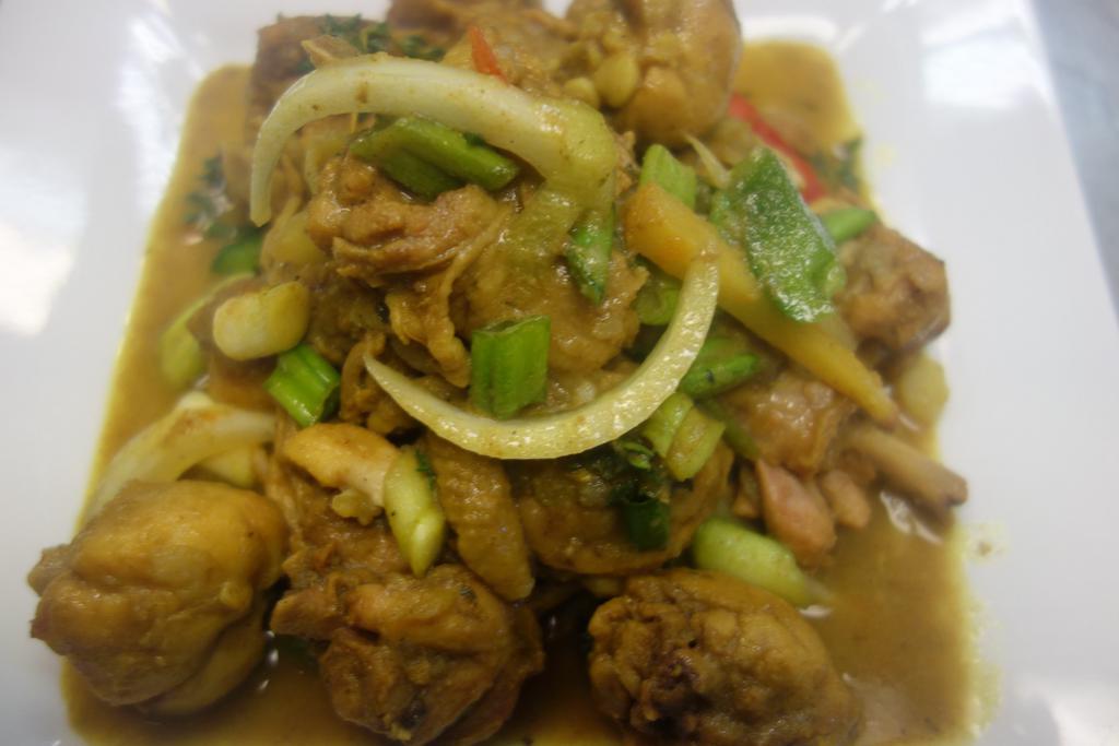 Bone in Curry Chicken · Chicken season to the bone in Caribbean spices and curry
powder. cooked in fresh herbs.