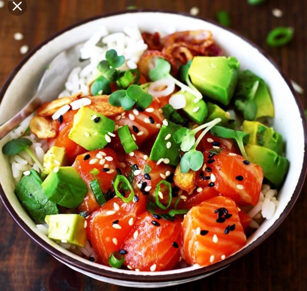 Salmon Poke Bowl · Sushi rice, lettuce, salmon, avocado, cucumber, seaweed salad, ginger, sesame seed and choice of spicy mayo, eel sauce.