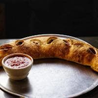 Spinach Calzone · Stuffed with ricotta, mozzarella, grated cheese and spinach.
