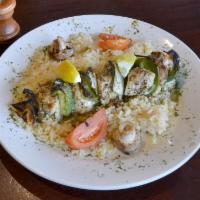SINGLE Chicken Kabob · Chicken breast skewered with fresh vegetable served over rice pilaf, and topped with our lem...