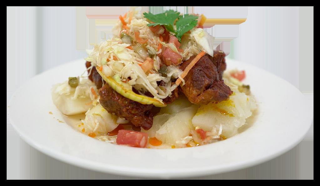 Chancho con Yuca · Chunks of marinated fried pork served with boiled cassava and fresh cabbage salad.