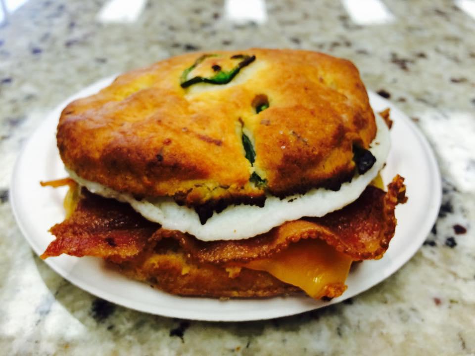 Cheddar Jalapeno Sconewich · Cheddar Jalapeno savory scone sliced open and filled with egg and cheddar cheese. Additional proteins can be added.
