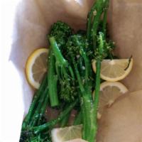 Oven-Roasted Broccolini · Broccolini tossed with olive oil, garlic and spices, oven-roasted and sprinkled with Parmesan.