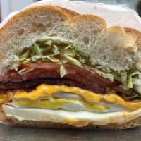 2. El Grammero Specialty Breakfast Sandwich · 2 eggs scrambled, bacon, cheese, lettuce, tomato, onion, ketchup, mayo, and hot sauce on a r...