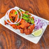 Chennai Chicken Pakoda · Cut chicken pieces battered in chick peas flour and deep fried with herbs and spices.