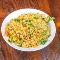 Chicken Fried Rice · Aromatic stir fried rice with finely chopped cabbage, carrots, bell peppers and chicken
