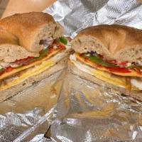 Western Sandwich · Eggs, bacon, cheddar, chipotle sauce, green pepper, red pepper and red onion.