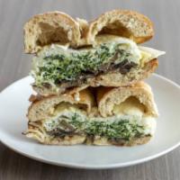 The Greenpoint · Egg whites, spinach, mushroom, and swiss on a scooped bagel.