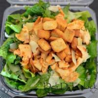 Chicken Caesar Salad · Thick sliced grilled seasoned chicken breast on crisp hand cut romaine lettuce with shaved a...