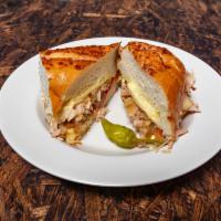 Turkey Melt Sandwich · Grilled sliced turkey, topped with melted swiss cheese, onions, pickles, tomatoes, and our h...