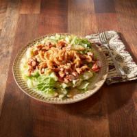 Tom's BBQ Salad · Bed of lettuce, tomatoes, cucumbers, topped with ranch dressing, our famous mild BBQ sauce a...