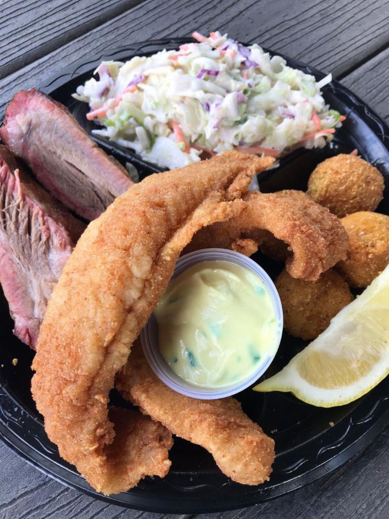 Rib and Fish Combo Dinner · Two ribs and hand-breaded fish, served with your choice of two side dishes, hush puppies, tartar sauce and lemon.