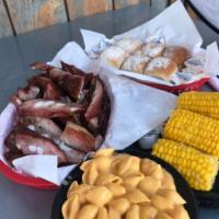 Tom's Tub of BBQ · 2 lb. of your choice of meat. Includes 2 large homemade side dishes, 6 dinner rolls and hot ...