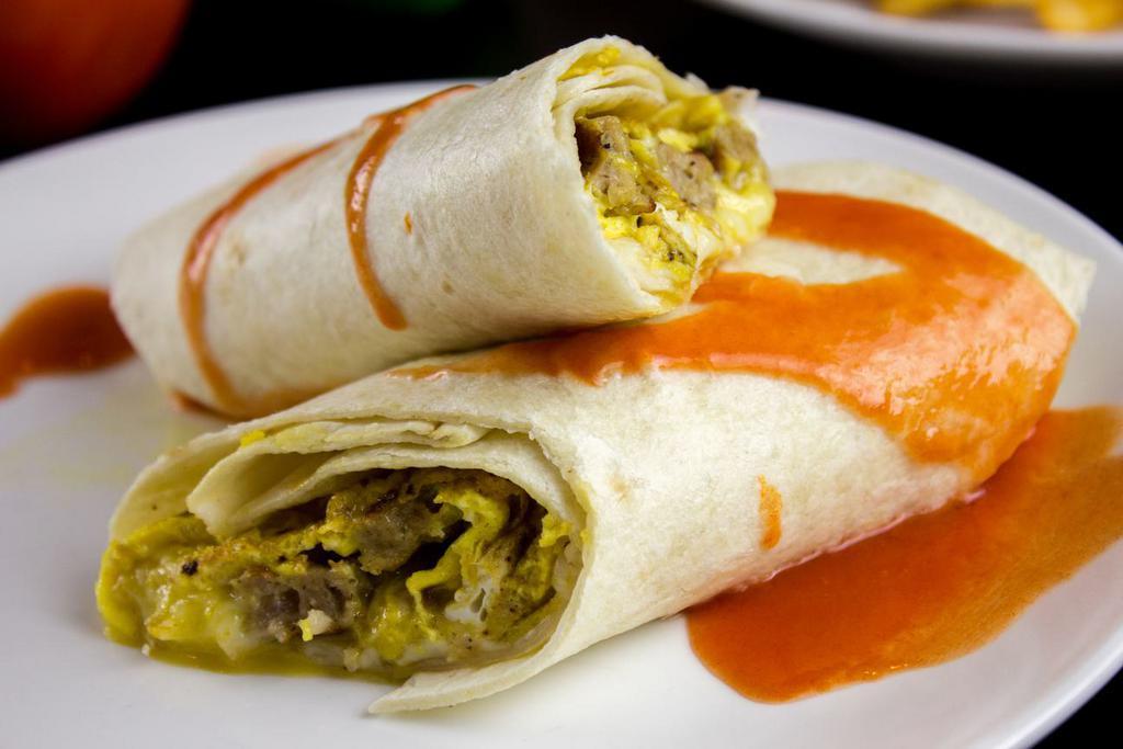 Breakfast Burrito Breakfast · Egg, cheese with bacon, sausage or ham wrapped in a flour tortilla.