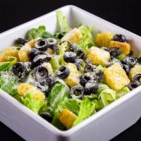 Caesar Salad · Romaine lettuce, croutons, black olives, Parmesan cheese. Included a side of Garlic Bread an...