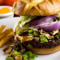 Verdi Texas Burger · Served with BBQ sauce, ranch dressing, green peppers, mushrooms, lettuce, onion and American...