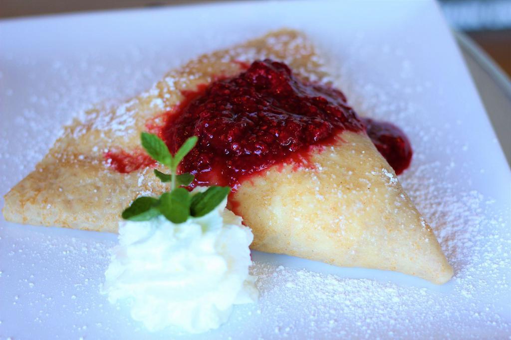 White Chocolate Raspberry Crepe · Raspberry compote, bananas and white chocolate mousse.