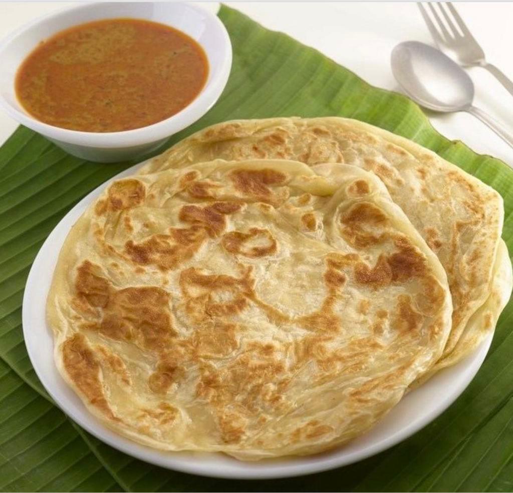 Malayan Flatbread · Multi-layered pastry and curry dipping sauce.
